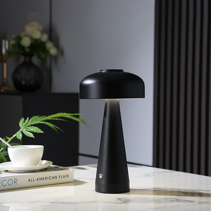 Mushroom Charging Lamp glowing on a marble console